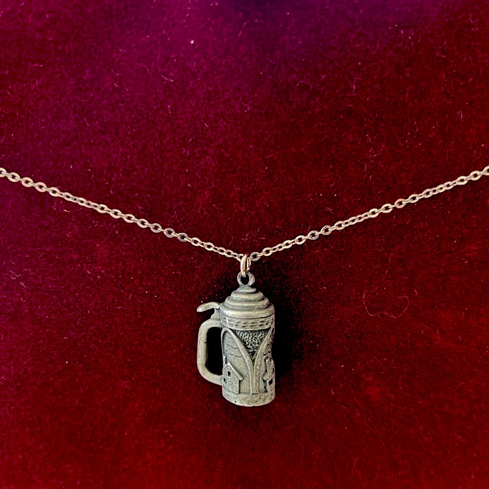 Busch Gardens Beer Stein with chain. Lid does not open. It is solid weight.